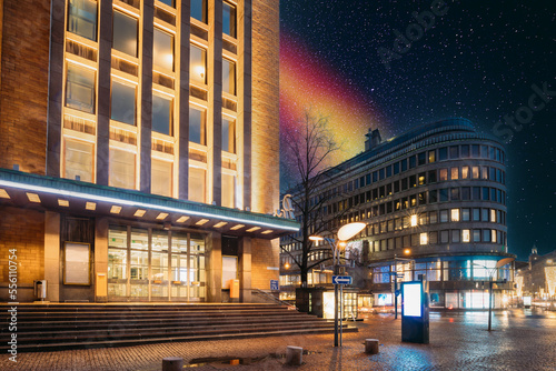 Helsinki, Finland. Post Office Building And Hotel In Evening Night Illumination. Colourful Night Dark Blue Starry Sky In Blue-orange Colors. Glowing Stars Background Backdrop With Sky Gradient.