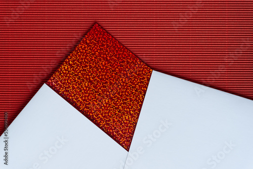 rich paper background featuring red glitter paper, white bristol board, and red corrugated paper