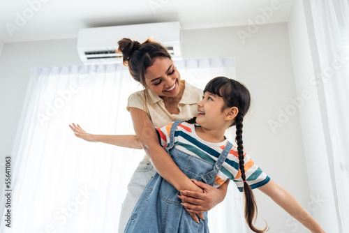 Caucasian happy family, parent spend free time with kid together at home.