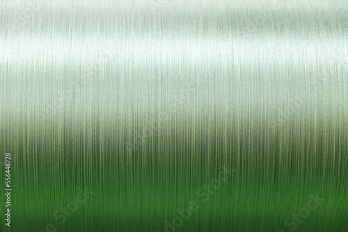 Closed up of green color of thread textured background (Focus at center of picture)