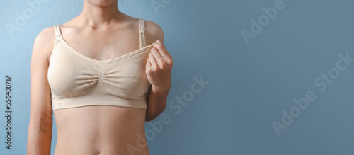 Close up asian woman in nursing bras bra isolated background for breastfeeding and pregnant feeding embrace bra concept.