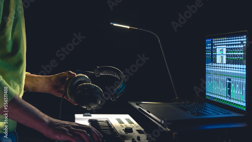 A man composer, producer, arranger, songwriter, musician hands arranging music.