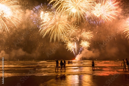New Year on the beach. Celebrating with exploding colorful fireworks.