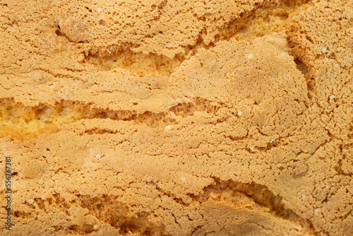 sponge cake crust texture with cracks, soft focus
