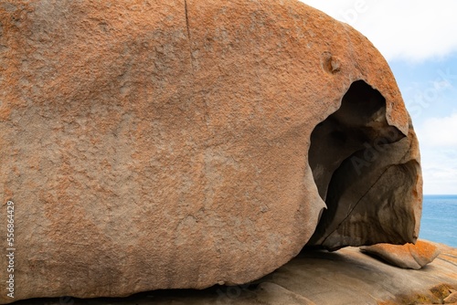 Remarkable Rocks in Flinders Chase National Park on Kangaroo Island, South Australia. Rocks covered by golden orange lichen. Black mica, bluish quartz and pinkish feldspar comprise most of the granite