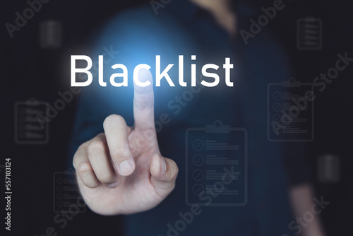 Blacklist concept, people touch blacklist icon on visual screen.