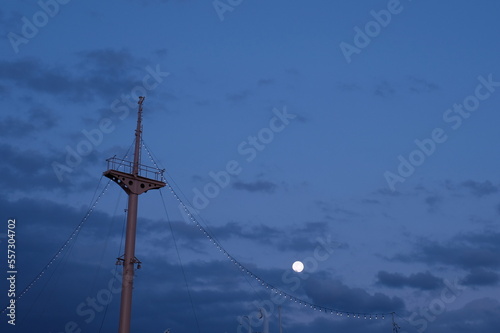 mast of the ship and moon in the night