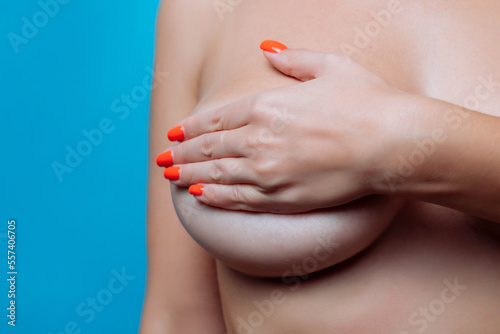 Big Breasts of a sexy woman, close up. Plastic correction and surgery concept.