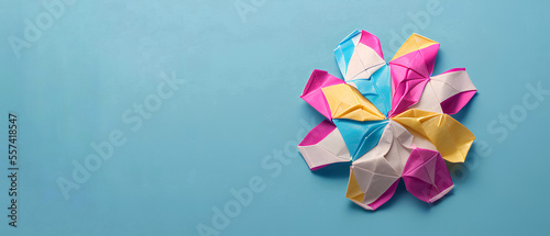 Generative AI. Colorful origami paper crafts on a blue background. copy space background for your text or message.