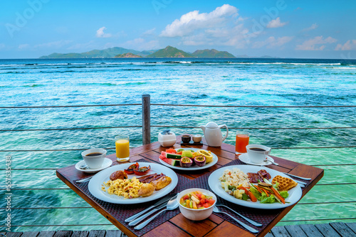 Breakfast on the beach by the pool with a look over the ocean of La Digue Seychelles,tropical Island