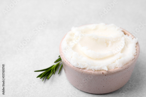 Delicious pork lard in bowl on light table, space for text