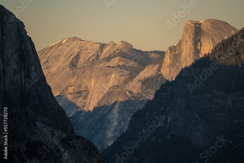 Far photo of Yosemite valley in summer covered by sun rays in sunset