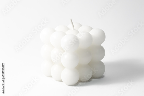 White candle square shape on a white background isolated.