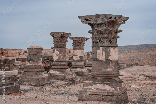 Antient antique columns. Ruins of the Greek - Roman city Hippos - Susita located on Golan Heights hill in northern Israel on the Sea of Galilee