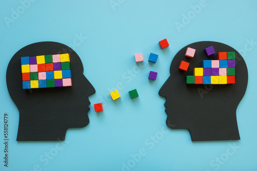 Heads with colorful cubes as symbol of mentoring and psychotherapy.