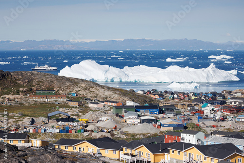 artic town with icebergs in background