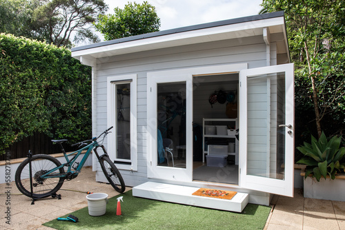 Modern hampton white grey backyard storage garden shed bike clean organise clever tidy tiny house mtb stand wash