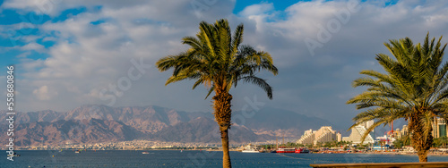 View on public beaches in Eilat - Israeli southernmost and famous tourist resort and recreational city, located on the northern shores of the Red Sea, Middle East