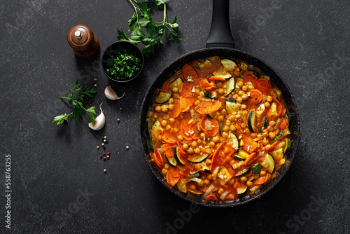 Chickpea and zucchini saute with carrot and garlic. Classic italian side dish. Top view
