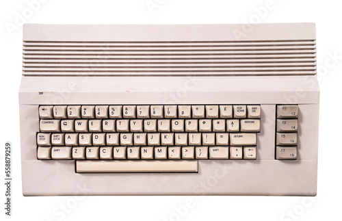 vintage cream colored home computer keyboard isolated on white