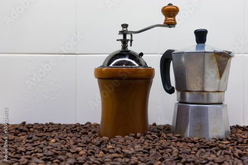 Coffee maker and coffee grinder placed on coffee