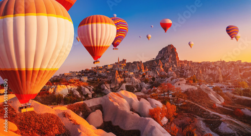 Hot air balloons fly over deep canyons, valleys Cappadocia, Goreme National Park Turkey, aerial drone view