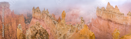 panorama view of sandstone hoodoos of bryce canyon covered in clouds