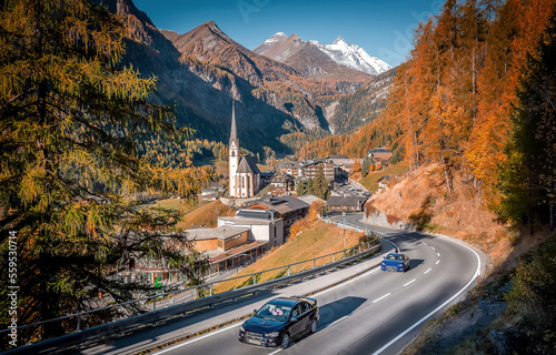 Incredible scenery of European Alps in sunny morning. Heiligenblut church in Austria with Grossglockner peak in background Grossglockner High Alpine road is a most popular place of travel