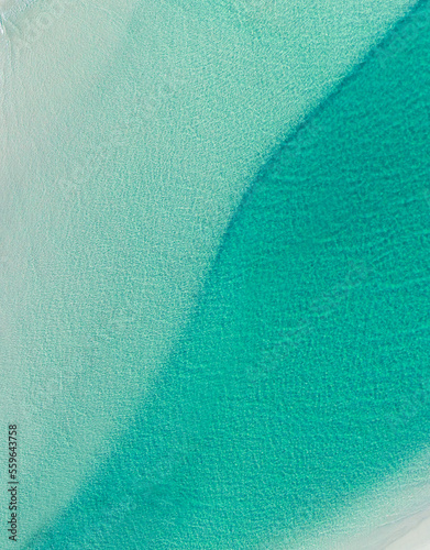 Aerial view of ocean textures with pristine blue ocean water