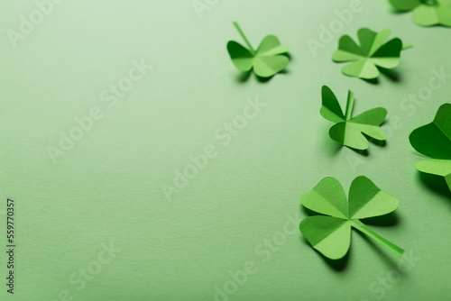 St. patrick's day. green background with clover leaves: shamrocks . copy space. Paper craft