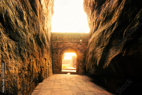 Beautiful sunlight coming out of Badami fort ,gateway to lower Shivalaya temple during sunset.