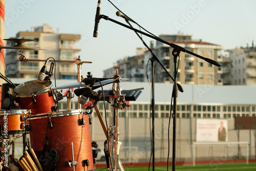 Close up shot of drum set and microphone for a concert.
