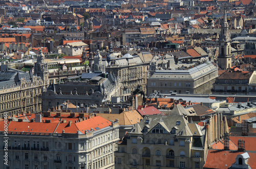 Skyline of Budapest, Hungary. Rooftop view of Ferenciek square from Gellert Hill. Buildings, old towers, and colorful cityscape. Historical downtown neighborhood houses, Hungarian urban landscape