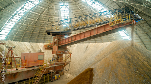 Industrial plant top view. Cement plant, raw material processing equipment. Manufactory with technological equipment. Sand destined to the manufacture of cement in a quarry.