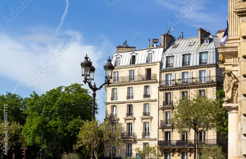 Old beautiful Parisian buildings near Buttes Chaumont park in the 19th arrondissement in Paris.