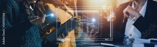 Analyst working with computer in Business Analytics and Data Management System to make report with KPI and metrics connected to database. Corporate strategy for finance, operations, sales, marketing