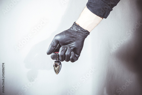 sexy man holds a BDSM anal plug in his hands.