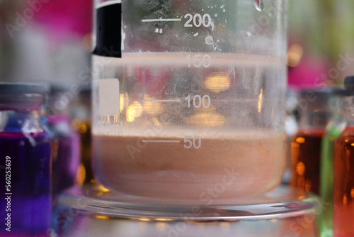 Preparation of a brown insoluble substance of manganese sulfide in a beaker.