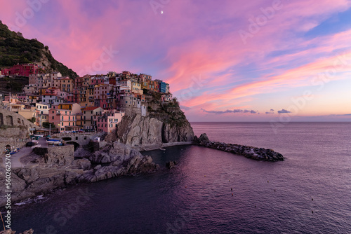 Small touristic town on the coast, Manarola, Italy. Cinque Terre. Colorful Sunny Sunset Fall Season.