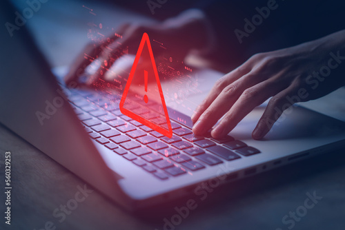 System hacked warning alert on notebook (Laptop). Cyber attack on computer network, Virus, Spyware, Malware or Malicious software. Cyber security and cybercrime. Compromised information internet.