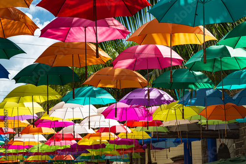 Colorful umbrellas spanning street at Caudan Waterfront shopping center, Port Louis, Mauritius