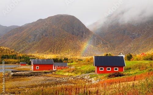 Beautiful Norwegian landscape with a traditional houses and cloudy sky.Norwegian fjord.