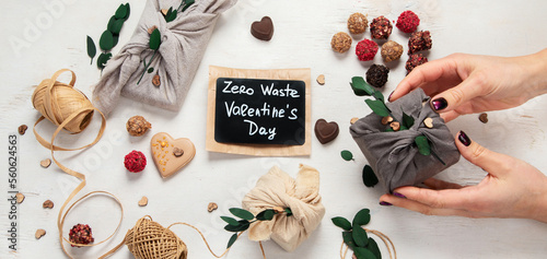 Valentine's Day Zero Waste Concept. Eco-friendly linen packaging as a gift for Valentine's Day in furoshiki style. Simple eco presents plastic free.