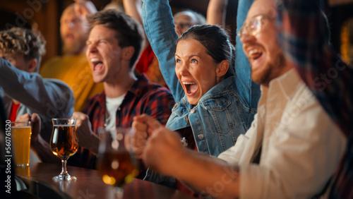 Group of Diverse Friends Cheering for Their Team, Drinking Beer at a Pub Counter. Supportive Fans Cheering, Applauding and Shouting. Joyful Friends Celebrate Victory After the Goal.