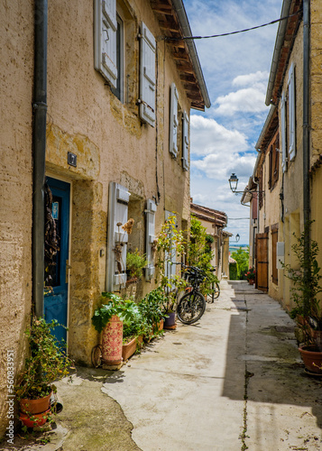 Cute, flowery and narrow streets of the small village of Lectoure in the south of France (Gers)