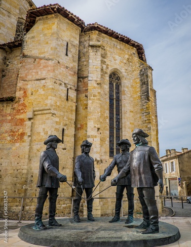 Statues of the Three Musketeers (actually 4) in front of Condom Cathedrale in the South of France (Gers)