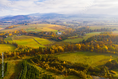Aerial autumn rural landscape with catholic church in Boboszow, Poland
