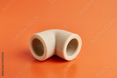The connection angle of the thermoplastic pipe at an angle of 90 degrees. Concept of installation of water supply and sewage systems.