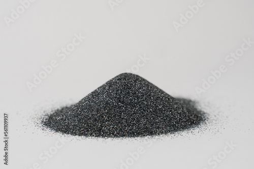 Silicon carbide powder close-up isolated on white background. Silicon carbide abrasive grit for restore stones to original flatness and leveling sharpening stones.