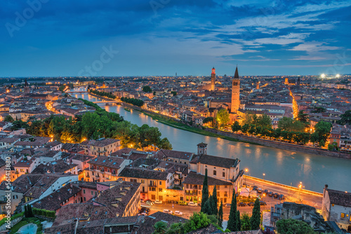 Verona Italy, high angle view night city skyline at Adige river